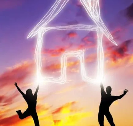 A couple and a house under a Spanish Sunset